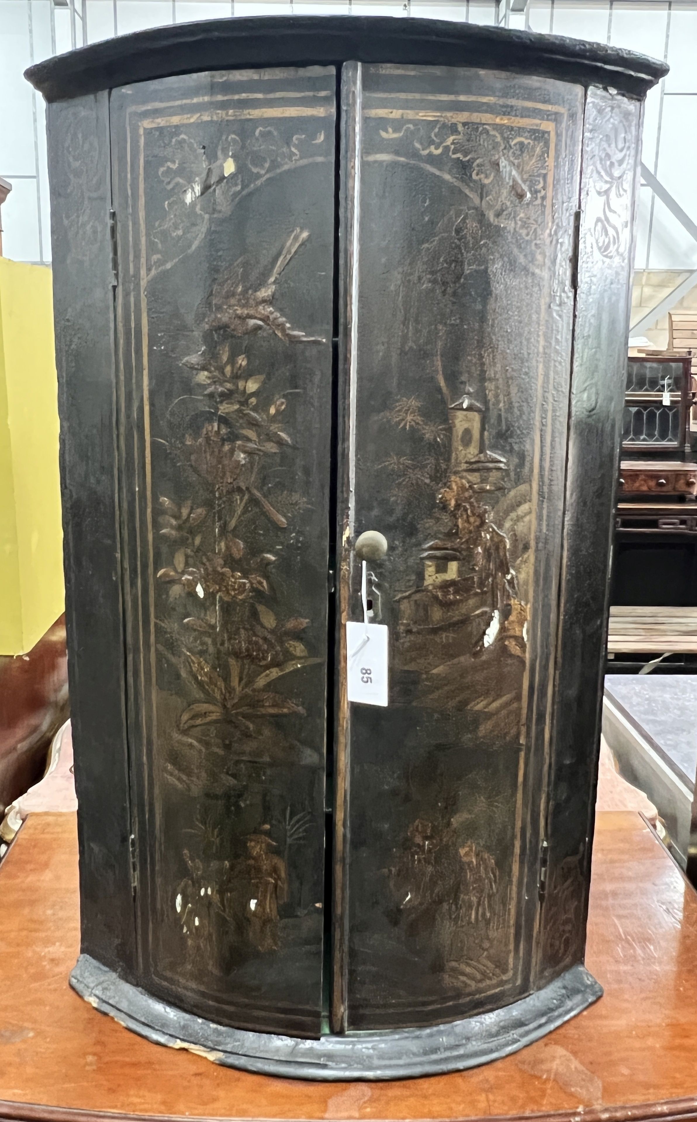 A 19th century chinoiserie lacquer bowfront hanging corner cabinet, width 56cm, depth 34cm, height 91cm